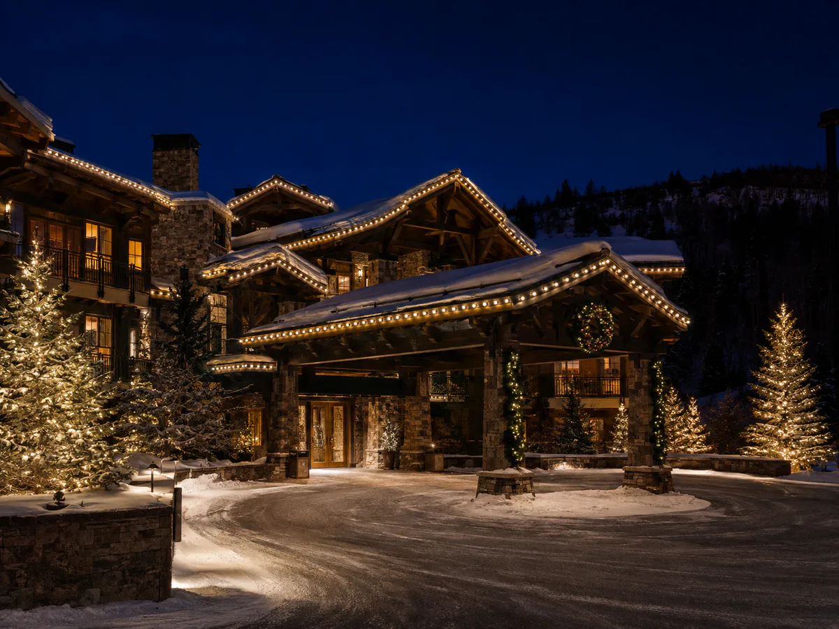 Luxury Park City resort porte cochere with professional roofline lights, garland, wreaths, and illuminated spruce trees